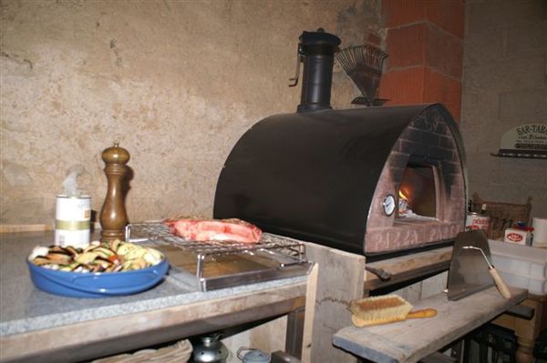 Frans koken in een Italiaanse pizzaoven